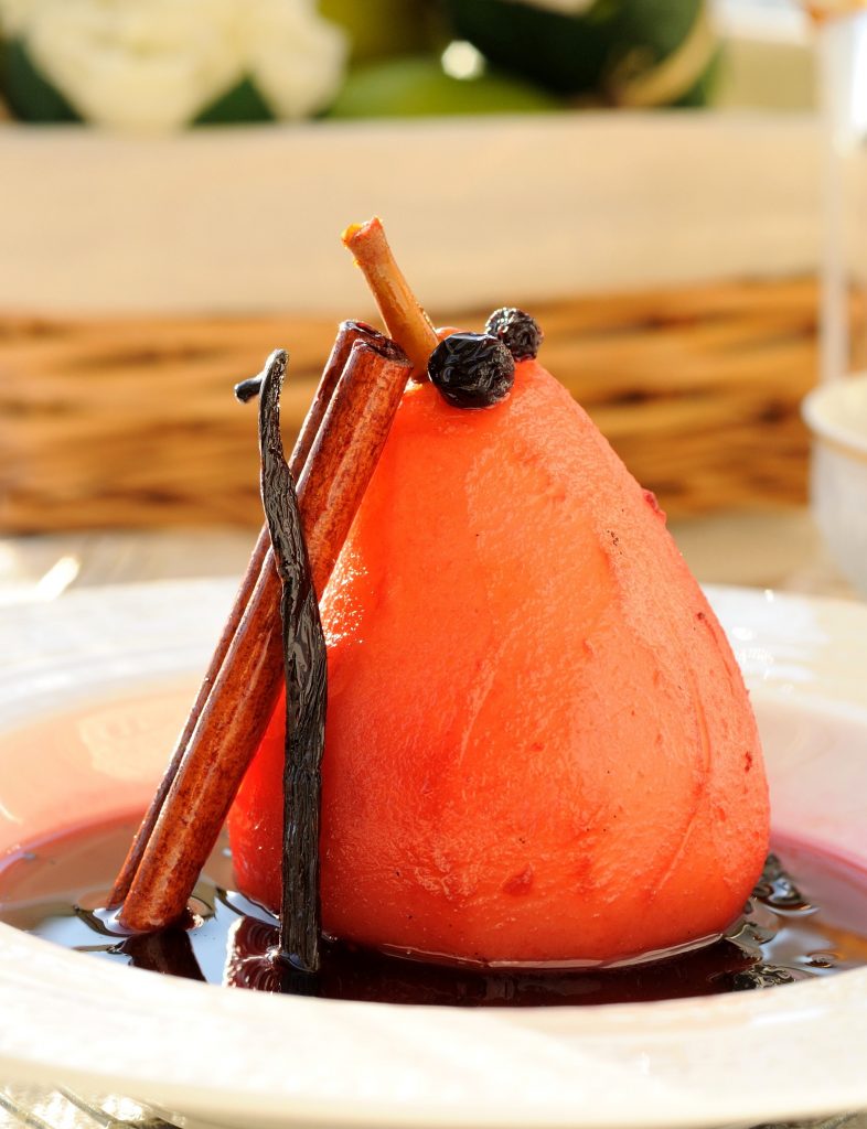 Poached pear in sweet sauce.